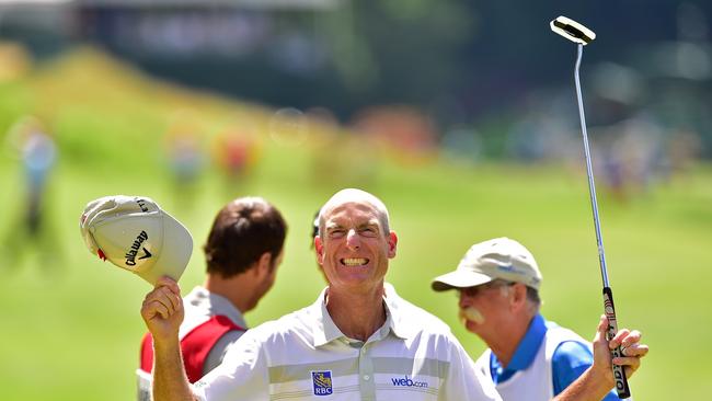 Jim Furyk of the United States celebrates after shooting a record setting 58.