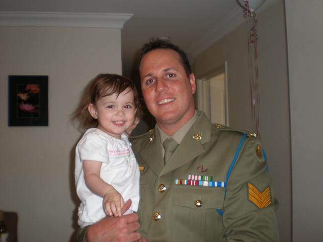 Brad Watts, in dress uniform, and Matilda are all smiles.