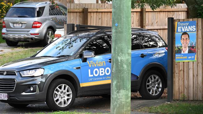 Vivian Lobo leaves the house where he’s been living in Wilston … which has a poster for that seat’s Liberal candidate on the fence. Picture: Lyndon Mechielsen/The Australian