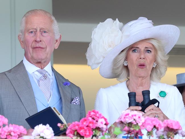 ASCOT, ENGLAND - JUNE 20: King Charles III and Queen Camilla react as they attend day three of Royal Ascot 2024 at Ascot Racecourse on June 20, 2024 in Ascot, England. (Photo by Chris Jackson/Getty Images)