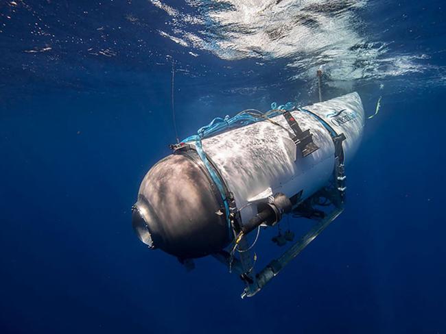 This undated image courtesy of OceanGate Expeditions, shows their Titan submersible beginning a descent. Rescue teams expanded their search underwater on June 20, 2023, as they raced against time to find a Titan deep-diving tourist submersible that went missing near the wreck of the Titanic with five people on board and limited oxygen. All communication was lost with the 21-foot (6.5-meter) Titan craft during a descent June 18 to the Titanic, which sits at a depth of crushing pressure more than two miles (nearly four kilometers) below the surface of the North Atlantic. (Photo by Handout / OceanGate Expeditions / AFP) / RESTRICTED TO EDITORIAL USE - MANDATORY CREDIT 