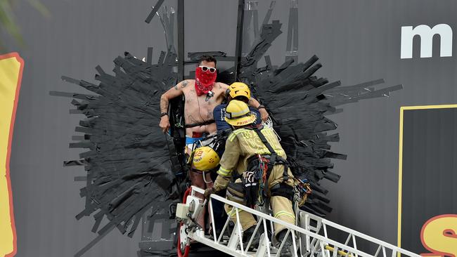 Steve-O was removed by firefighters after duct taping himself to billboard for the promotion of his new special Gnarly. Picture: Getty Images.