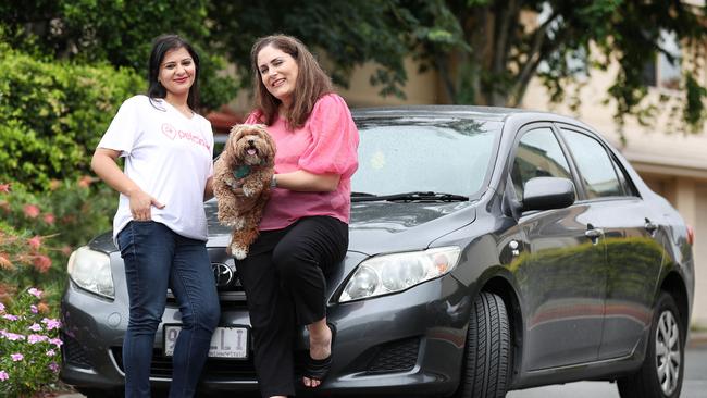 Pet Taxi driver Geet Mahna with PetCloud CEO Deb Morrison and her toy cavoodle Milly, 5. Pics Tara Croser.