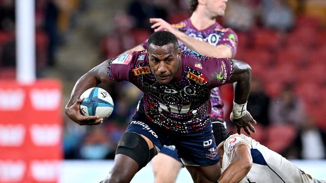 BRISBANE, AUSTRALIA - MAY 20: Suliasi Vunivalu of the Reds attempts to break away from the defence during the round 14 Super Rugby Pacific match between the Queensland Reds and the Moana Pasifika at Suncorp Stadium on May 20, 2022 in Brisbane, Australia. (Photo by Bradley Kanaris/Getty Images)