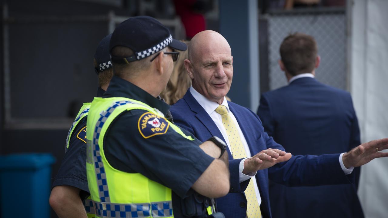 Premier Peter Gutwein speaks to members of Tasmania Police at the Hobart Cup. Picture: LUKE BOWDEN