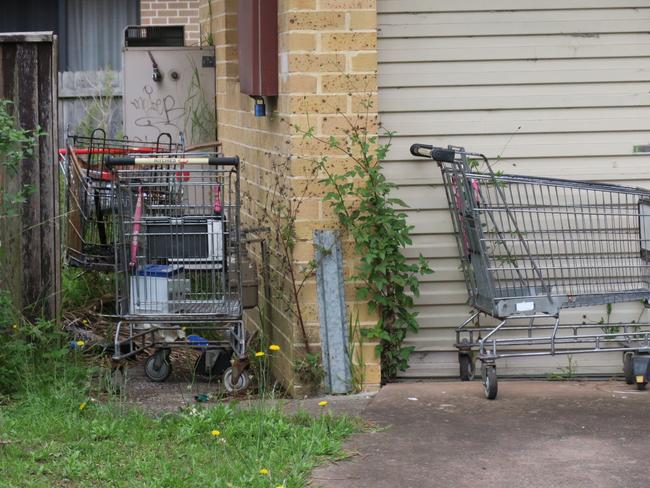 Shopping trolleys left abandoned at the vacant social housing duplex at 5-7 Faye Close, at Bateau Bay. Picture: supplied