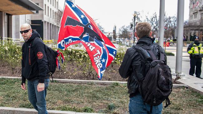 Trump supporters display a Confederate flag next to Washington’s Black Lives Matter Plaza during the Capitol riots. Picture: AFP.