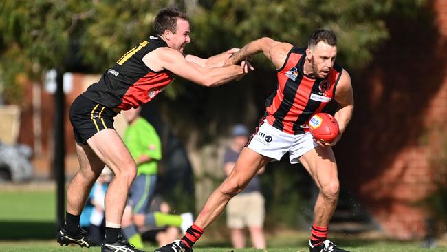 New ROC midfielder Jake Veide shrugs off Goodwood’s Tom Barry on Saturday. Picture: Keryn Stevens