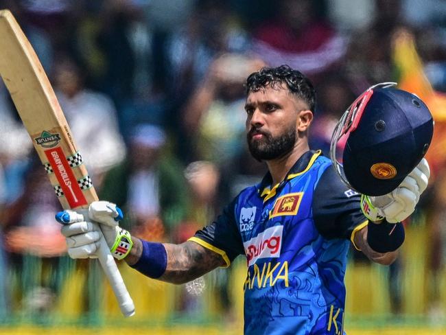 Sri Lanka's Kusal Mendis celebrates after scoring a century (100 runs) during the second and last one-day international (ODI) cricket match between Sri Lanka and Australia at the R. Premadasa International Cricket Stadium in Colombo on February 14, 2025. (Photo by Ishara S. KODIKARA / AFP)