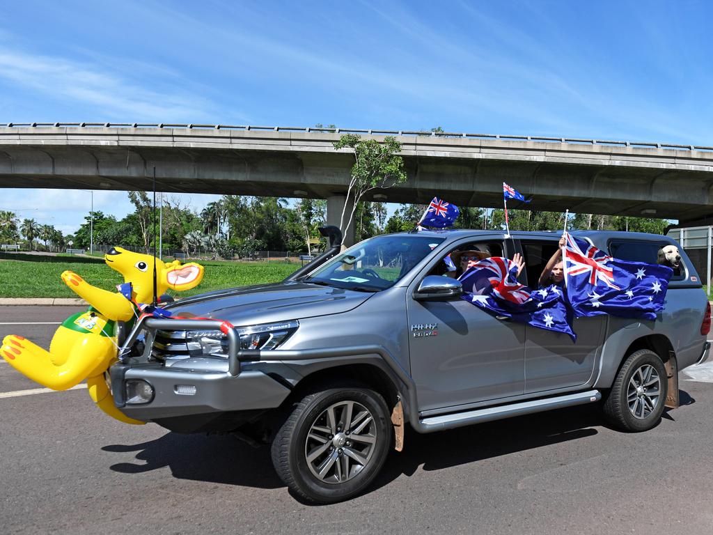 A ute rounds the corner at the Ludmilla flyover as part of the annual Variety NT Australia Day Ute run. Picture: Che Chorley