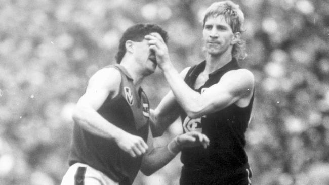 David Rhys-Jones helps Garry Lyon clean out his eyes.