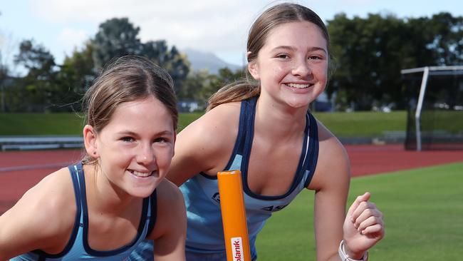 Aspire Cairns and Pace Project running squads will mark the easing of COVID-19 restrictions by joining forces on Monday to run a sub 2 hour marathon. Grace Campbell, 10, and Jorja Catelan, 14, will participate in the 400 metre relays held over 105 laps at Barlow Park. PICTURE: BRENDAN RADKE.