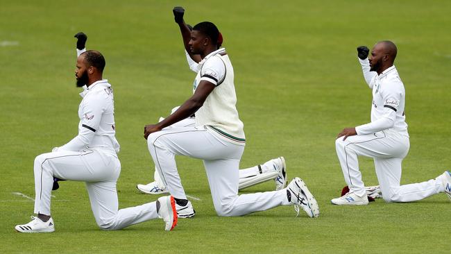 Players takes a knee in support of the Black Lives Matter movement on the first day of the first Test between England and the West Indies in July.