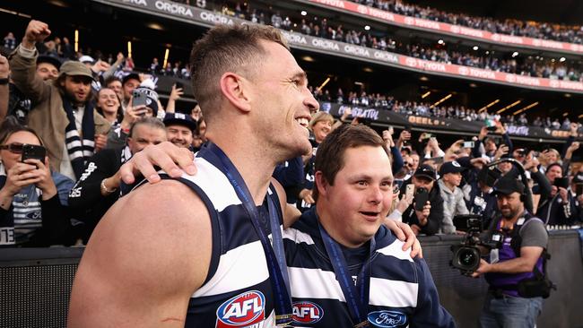 Joel Selwood and Sam Moorfoot on the MCG after Geelong’s grand final win. Picture: Cameron Spencer/AFL Photos