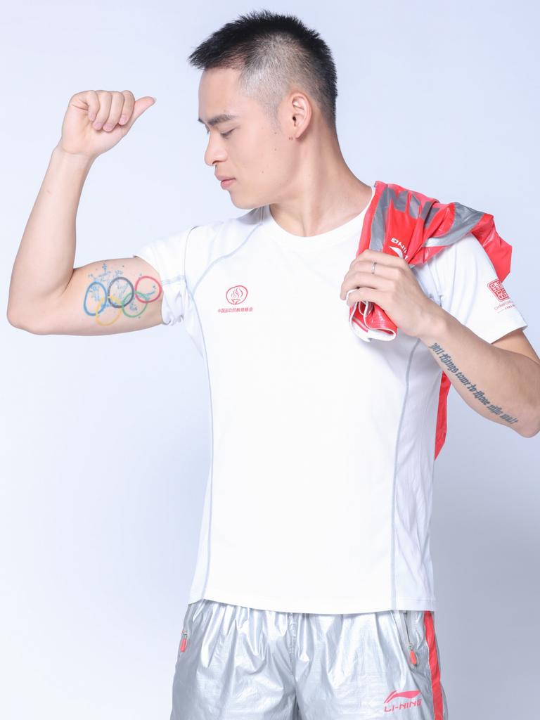 Shixin Li shows off his tattoo.