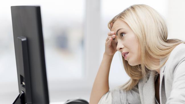 picture of stressed businesswoman with computer at work