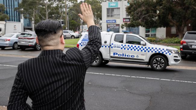 Howard X appears to wave at a police vehicle. Picture: Jason Edwards
