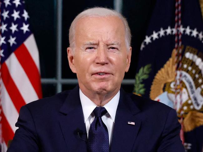 TOPSHOT - US President Joe Biden addresses the nation on the conflict between Israel and Gaza and the Russian invasion of Ukraine from the Oval Office of the White House in Washington, DC, on October 19, 2023. President Joe Biden will deliver a rare Oval Office speech October 19, 2023 urging Americans to back military aid for Israel and Ukraine at what he calls a perilous moment for democracy around the globe. (Photo by JONATHAN ERNST / POOL / AFP)