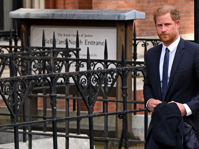 (FILES) Britain's Prince Harry, Duke of Sussex leaves from the Royal Courts of Justice, Britain's High Court, in central London on March 27, 2023. Lawyers for Prince Harry on December 5 began a legal challenge over his security arrangements in the UK, after he quit frontline royal duties and moved to North America.  The case about his loss of UK taxpayer-funded protection is the latest in a string of court proceedings initiated by Harry, whose father is King Charles III. (Photo by JUSTIN TALLIS / AFP)