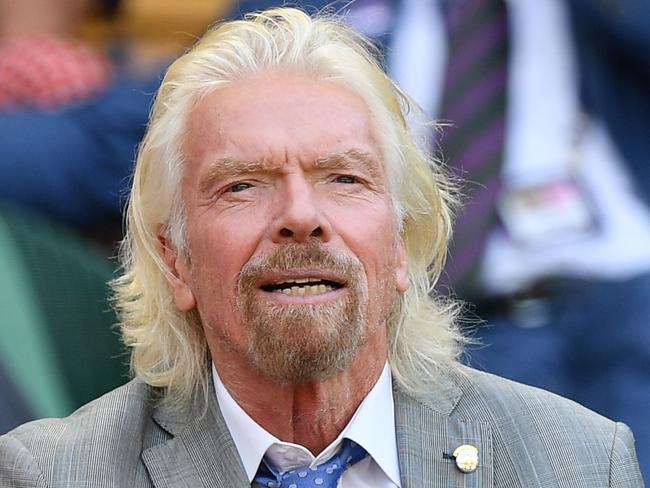 British businessman Richard Branson sits in the Royal Box above Centre Court as Ukraine's Elina Svitolina plays  against Romania's Simona Halep during their women's singles semi-final match on day ten of the 2019 Wimbledon Championships at The All England Lawn Tennis Club in Wimbledon, southwest London, on July 11, 2019. (Photo by Daniel LEAL-OLIVAS / AFP) / RESTRICTED TO EDITORIAL USE