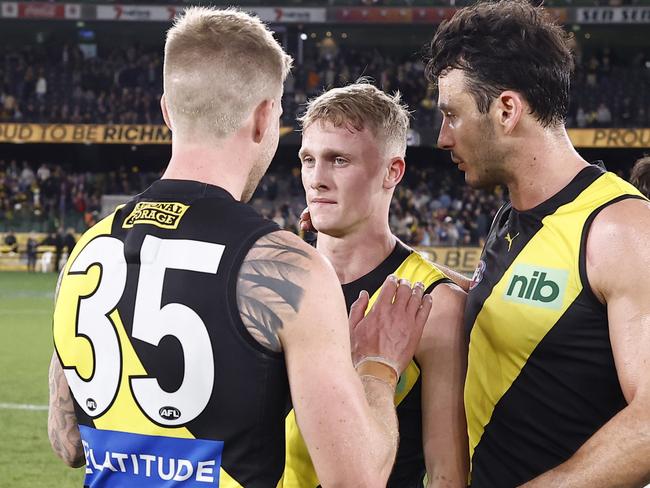 MELBOURNE, AUSTRALIA - JULY 22: Nathan Broad and Robbie Tarrant of the Tigers  console team mate Noah Cumberland after the round 19 AFL match between the Richmond Tigers and the Fremantle Dockers at Marvel Stadium on July 22, 2022 in Melbourne, Australia. (Photo by Darrian Traynor/Getty Images)