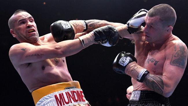 Anthony Mundine (left) and John Wayne Parr trade blows. Picture: AAP