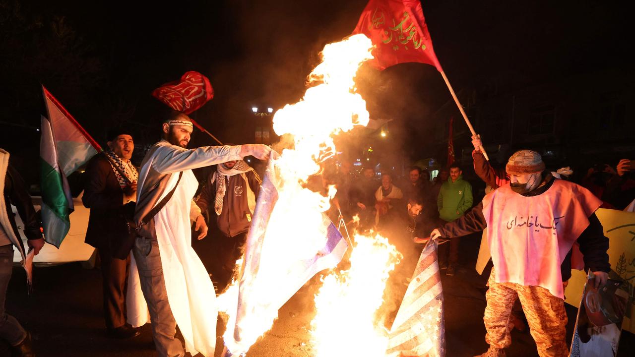 Iranian protesters burn an Israeli and a US flag during a demonstration in solidarity with the Palestinian people. Picture: ATTA KENARE / AFP