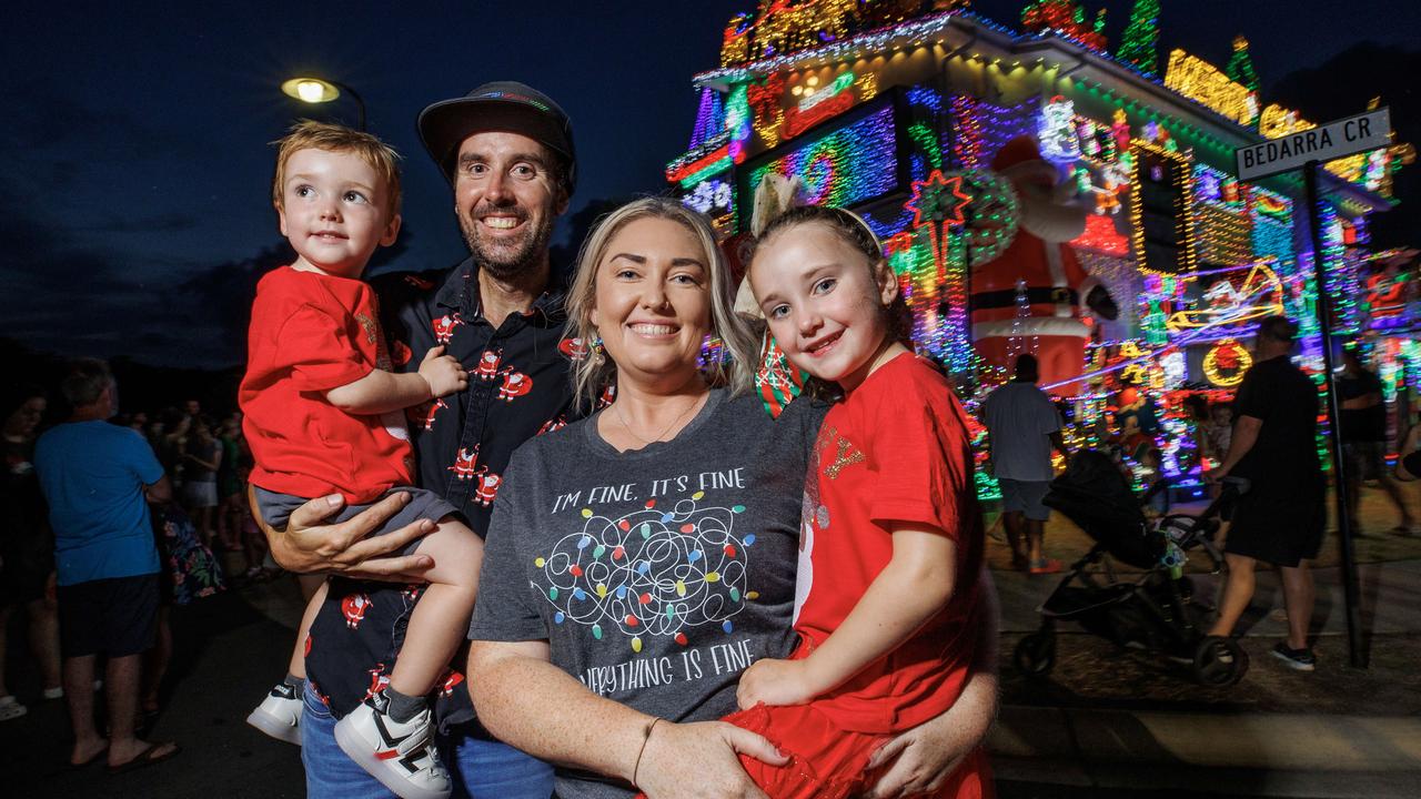 David and Chloe Strickland with their children Noah 2, and Piper 4, at their Burpengary East home covered in Christmas lights which is attracting hundreds of visitors nightly. Picture Lachie Millard