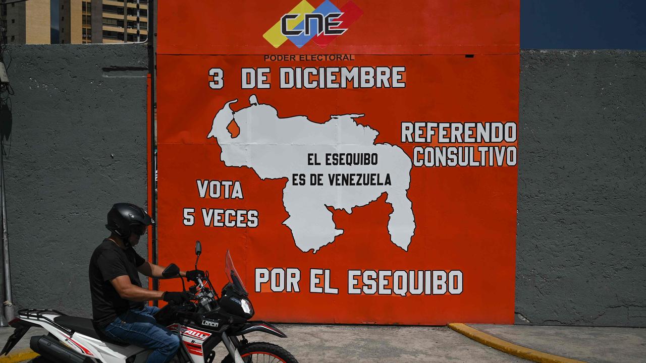 A map on a street in Caracas shows the nation including the territory of Essequibo, to the bottom right of the image. The picture says “The Essequibo is Venezuelan”. (Photo by Federico PARRA / AFP)