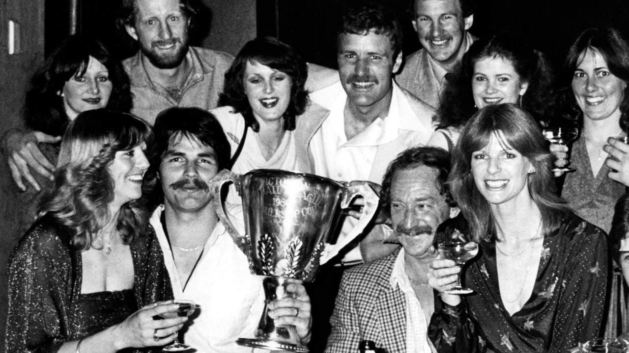 1980. Grand Final. Richmond coach Tony Jewell and his wife Marg with his victorious players and wives. Premiership Cup. David Cloke. Jim Jess. Emmett Dunne. Michael Roach.