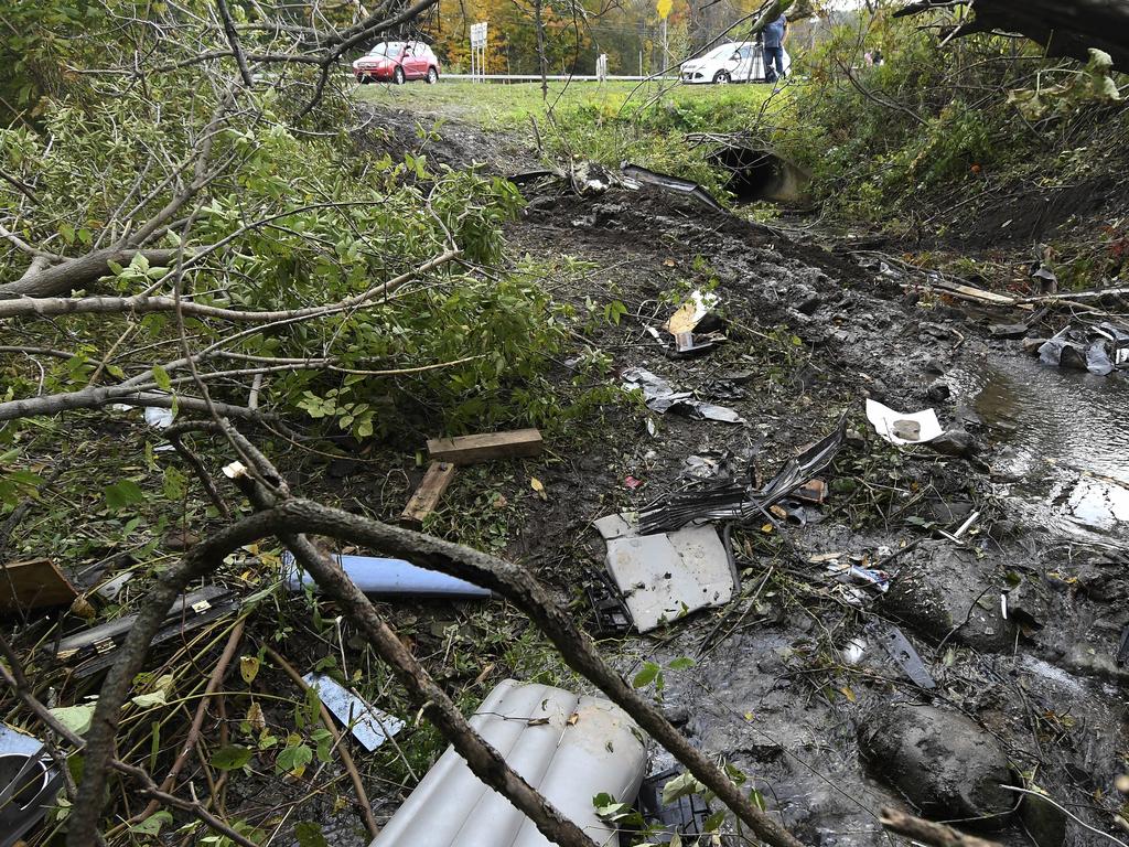 Debris scattered in an area at the site of the fatal limo crash. Picture: AP
