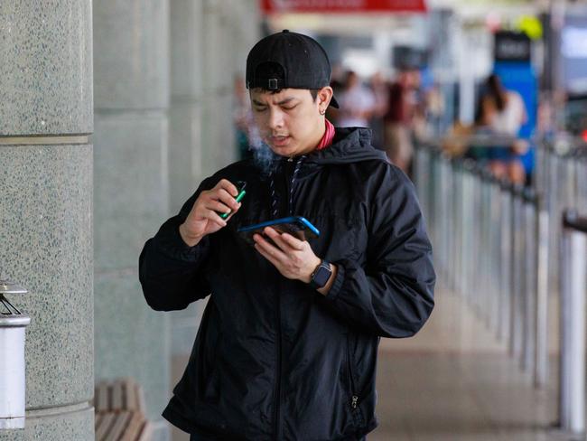 A man vaping at the Sydney airport on Thursday. Picture: Justin Lloyd