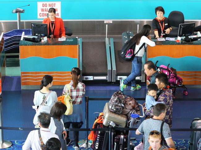 General, generic photos of passengers queuing to check in for their overseas flights at Cairns International Airport. PICTURE: BRENDAN RADKE