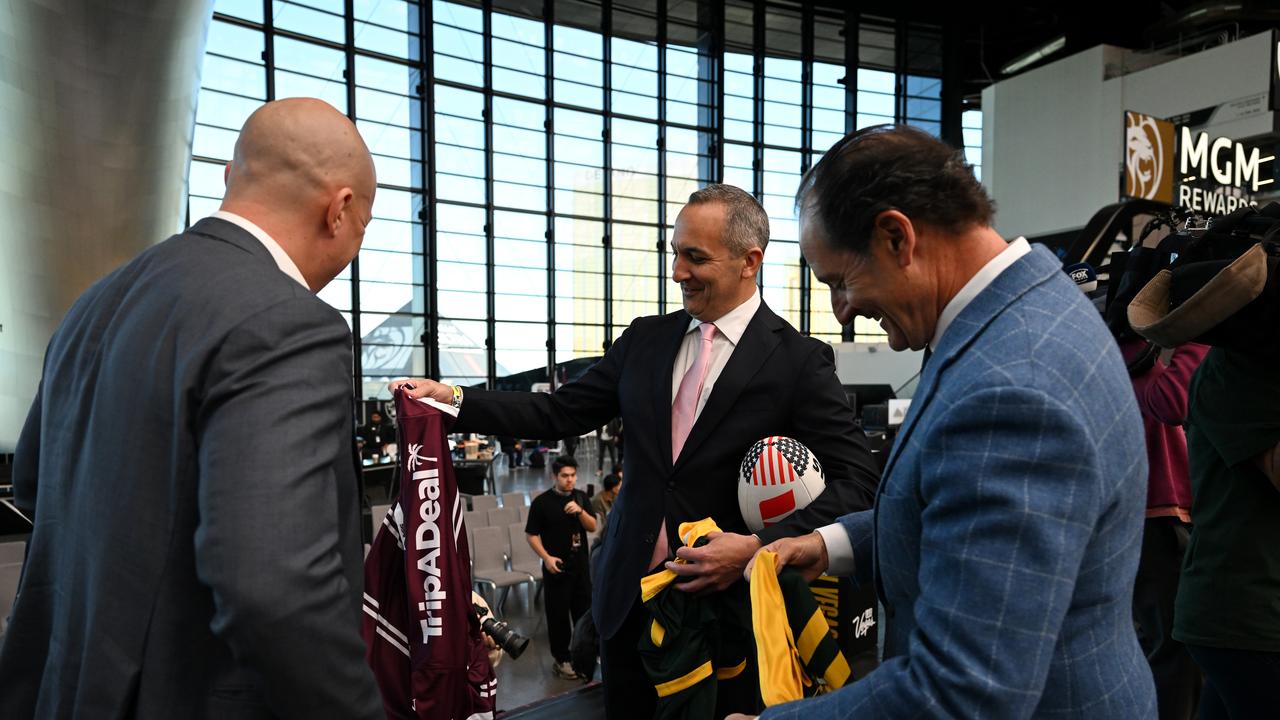 Abdo handing out jumpers to UFC executives Lawrence Epstein, right, and Peter Kloczko. Picture: Grant Trouville