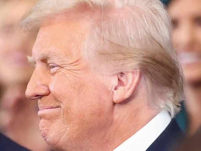 US Vice President-elect J.D. Vance and US President-elect Donald Trump react on the day of Trump's Presidential Inauguration at the Rotunda of the US Capitol on January 20, 2025 in Washington, DC. (Photo by Kevin Lamarque / POOL / AFP)