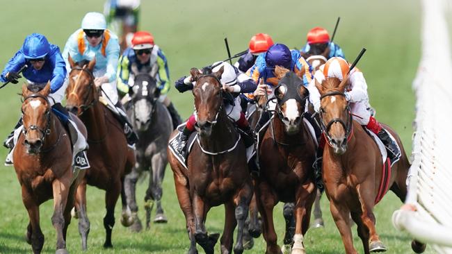 Jockey Craig Williams on Vow And Declare, right, to victory against Frankie Dettori riding Master Of Reality and Michael Walker on Prince Of Arran. Picture: AAP