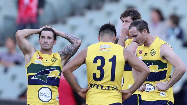 Dejected Eagles players after letting slip an eight-goal lead. Picture SARAH REED