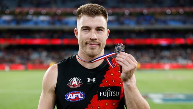 Zach Merrett of the Bombers poses with the Anzac Medal. Picture: Michael Willson/AFL Photos via Getty Images