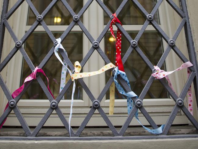 Ribbons in support of abuse victims are tied to window grates at Domus Australia, where Cardinal George Pell usually gives mass. Picture: David Mirzoeff/i-Images