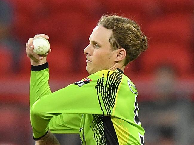 Jono Cook of the Sydney Thunder bowls a delivery during the Big Bash League (BBL) match between the Sydney Thunder and the Brisbane Heat at Spotless Stadium in Sydney, Tuesday, January 8, 2019. (AAP Image/Joel Carrett) NO ARCHIVING, EDITORIAL USE ONLY, IMAGES TO BE USED FOR NEWS REPORTING PURPOSES ONLY, NO COMMERCIAL USE WHATSOEVER, NO USE IN BOOKS WITHOUT PRIOR WRITTEN CONSENT FROM AAP