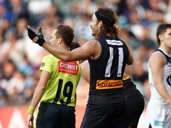 ADELAIDE, AUSTRALIA - APRIL 06: James Aish of the Dockers speaks with the umpire during the 2024 AFL Round 04 match between the Fremantle Dockers and the Carlton Blues at Adelaide Oval on April 06, 2024 in Adelaide, Australia. (Photo by Michael Willson/AFL Photos via Getty Images)