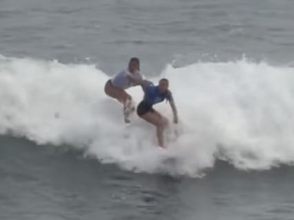 A Portugal surfer (left) tries to push Aussie girl Willoy Hardy (right) off her board and intimidate her during the world junior surfing event in El Salvador. https://www.instagram.com/p/C6zT1zqvXaZ/