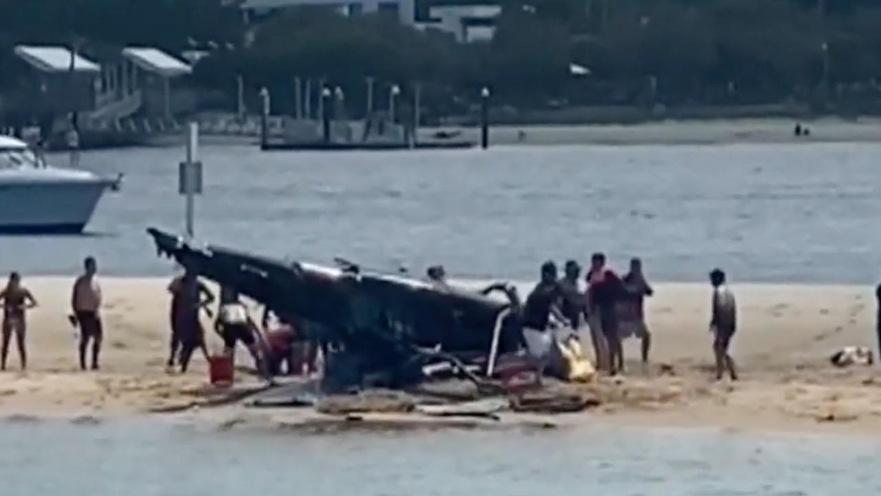 Four people died and many more were injured after two helicopters collided near Sea World on the Gold Coast. Picture: 9 NEWS