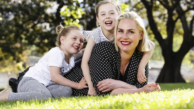 Hayley Markham with her daughters Milly, 5, and Elli, 6, in Cook and Phillip Park. Picture: Justin Lloyd