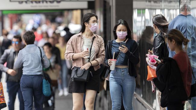 Mask wearers in Murray Street, Hobart, on Monday. Picture: Chris Kidd