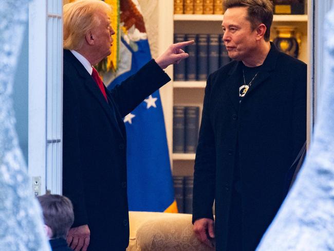 (FILES) US President Donald Trump speaks with Elon Musk (R) before departing the White House on his way to his South Florida home in Mar-a-Lago in Florida on March 14, 2025. President Donald Trump said on June 5, 2025, that he asked 