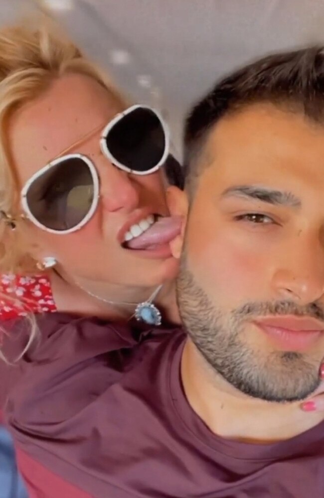 Britney licks her fiance’s ear as they jet off on a private plane.