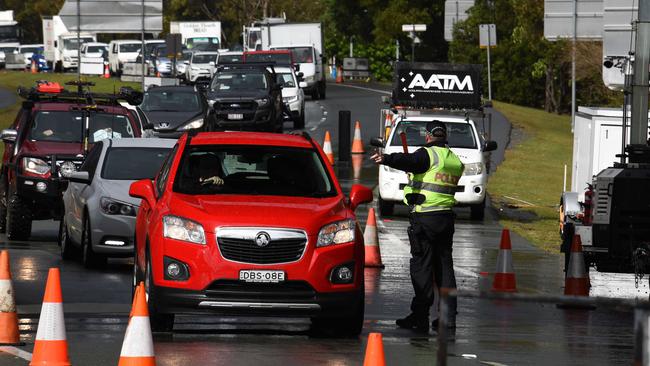 Police check cars at the Queensland border with NSW ahead of the border closure. Picture: NCA NewsWire / Steve Holland