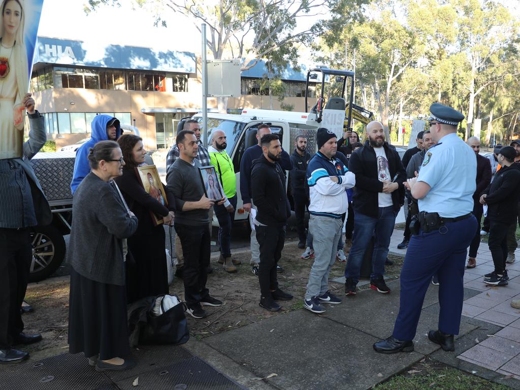 Protesters gathered outside the KIIS FM studio calling for Sandilands to be fired. Picture: John Grainger