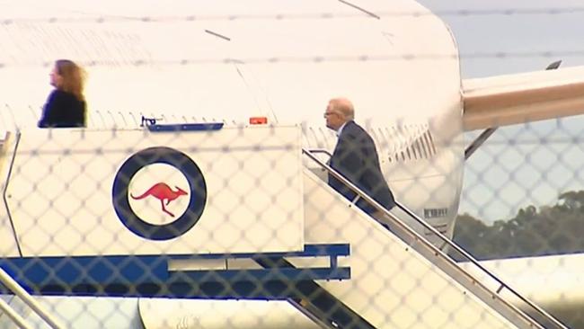 Scott Morrison and his wife Jenny board their plane. Picture: 7 News